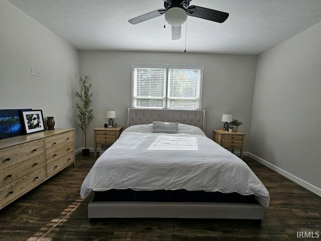 bedroom with ceiling fan and dark hardwood / wood-style flooring