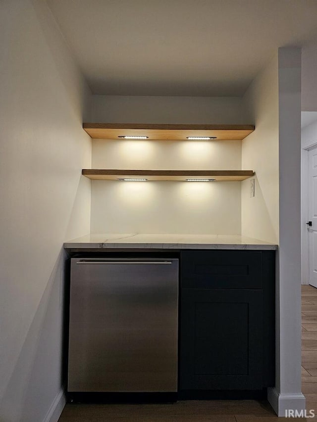 kitchen featuring stainless steel refrigerator and dark hardwood / wood-style floors