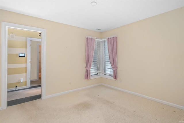 empty room with light colored carpet