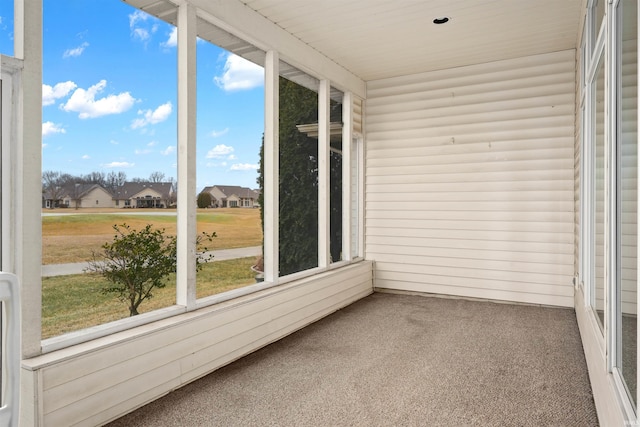 unfurnished sunroom featuring plenty of natural light