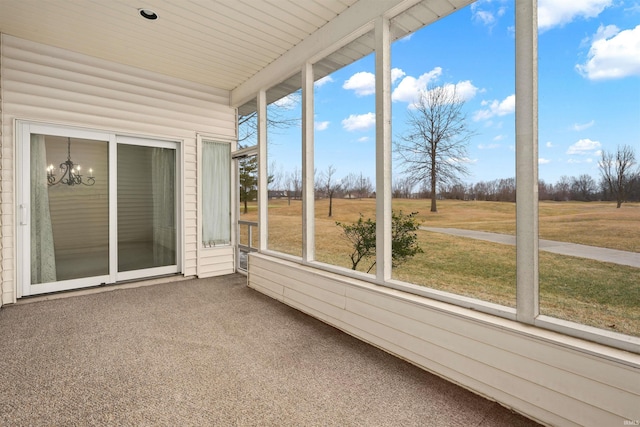 unfurnished sunroom featuring a notable chandelier