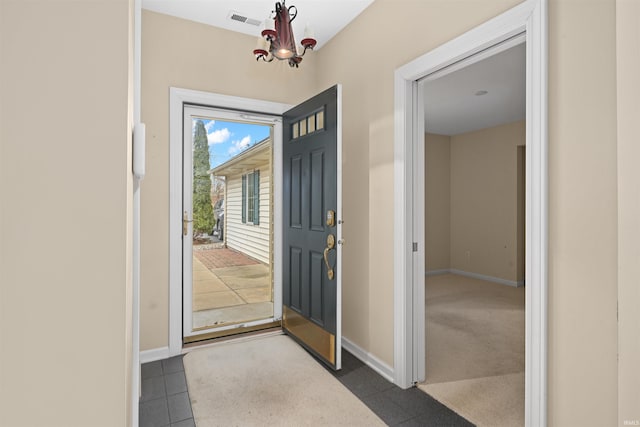 entryway featuring a chandelier