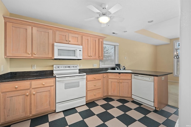 kitchen with light brown cabinetry, sink, ceiling fan, kitchen peninsula, and white appliances