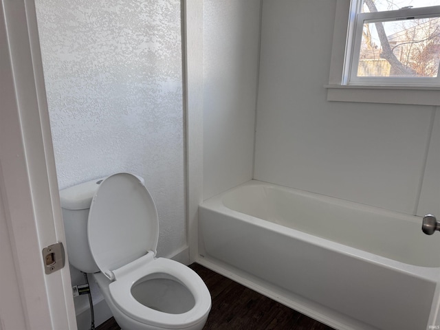 605 W 10th St, Muncie, IN 47302 - bathroom with toilet, hardwood / wood-style floors, and a bath