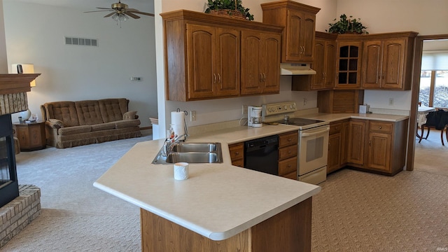 kitchen with a fireplace, white electric stove, dishwasher, sink, and kitchen peninsula