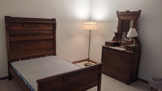 bedroom featuring light colored carpet