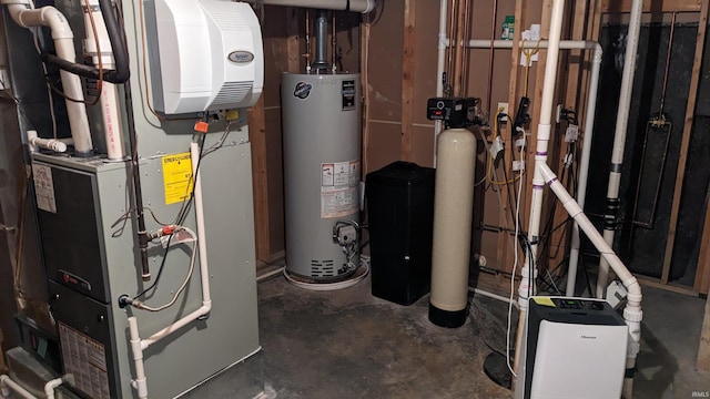 utility room with heating unit and water heater