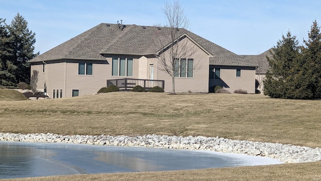 rear view of house with a lawn