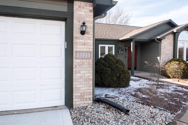 view of snow covered property entrance