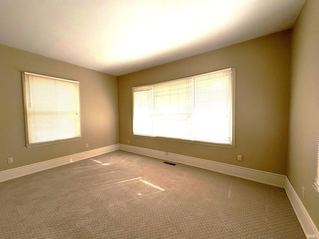 spare room featuring carpet flooring