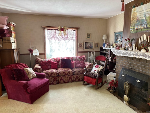 carpeted living room with a brick fireplace