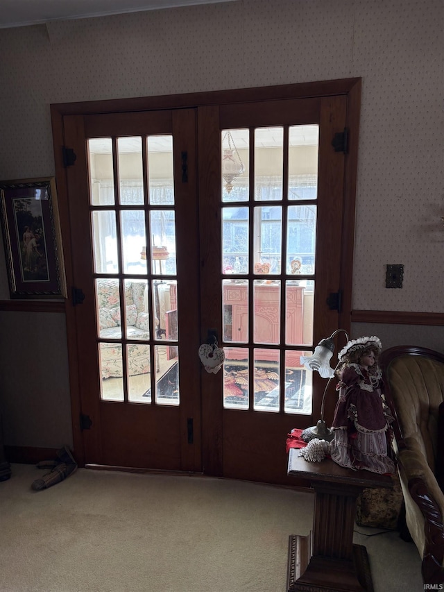 doorway with french doors and carpet flooring