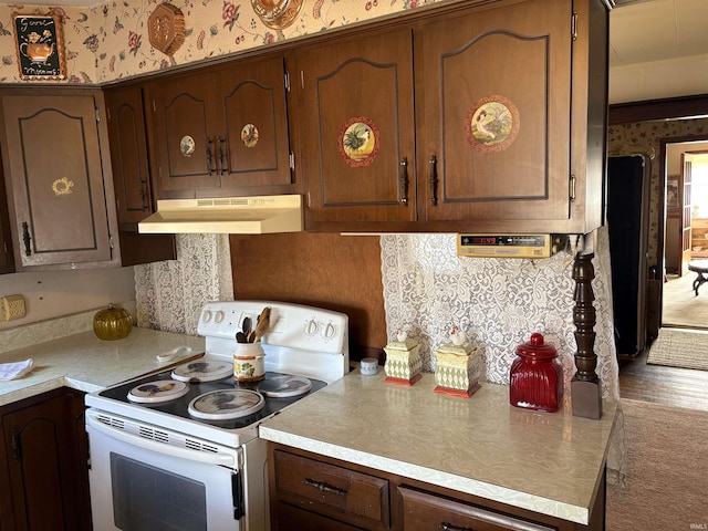 kitchen featuring white range with electric stovetop