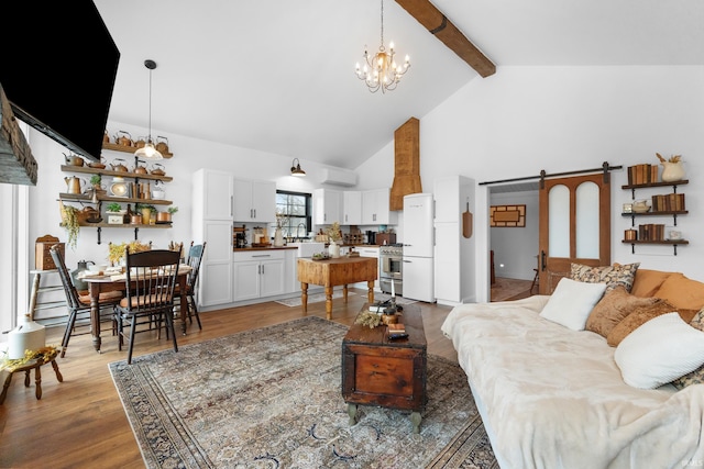 living room with hardwood / wood-style flooring, high vaulted ceiling, a wall mounted air conditioner, a barn door, and beamed ceiling