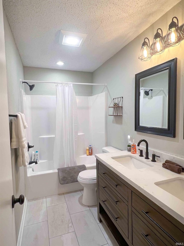 full bathroom featuring shower / bath combo, vanity, a textured ceiling, and toilet