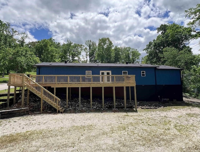 rear view of property with a wooden deck