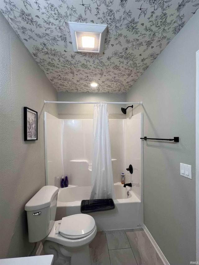 bathroom with shower / tub combo with curtain and toilet