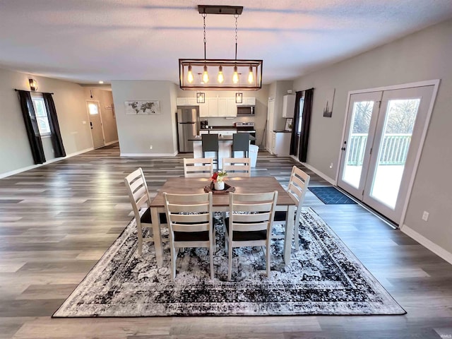 dining area with wood-type flooring