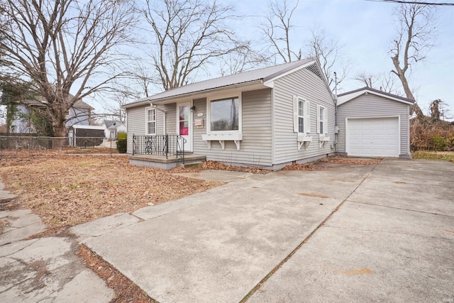 view of front of home with an outbuilding and a garage