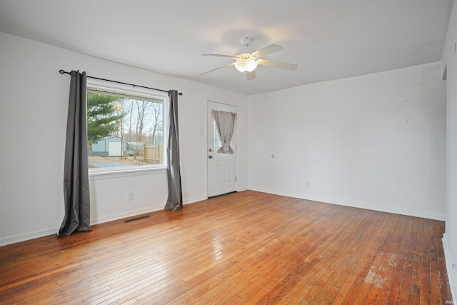 spare room featuring ceiling fan and light wood-type flooring