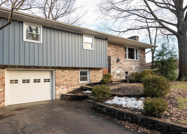 split foyer home featuring a garage