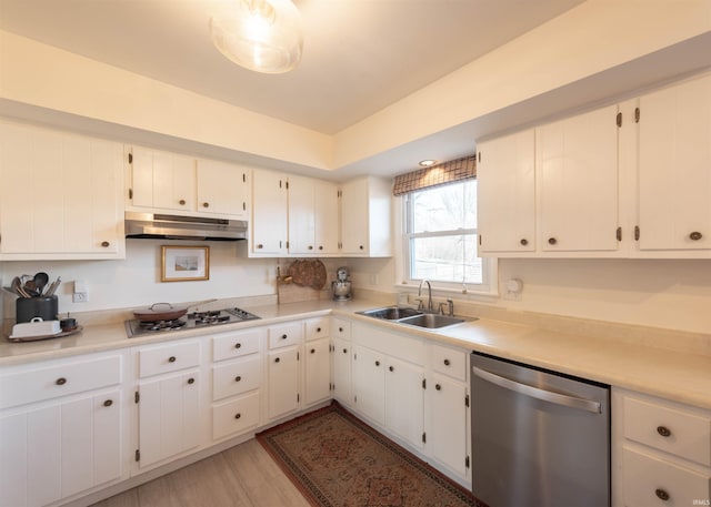 kitchen with sink, stainless steel dishwasher, white cabinets, and gas cooktop