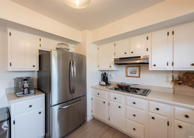 kitchen with white cabinetry and appliances with stainless steel finishes