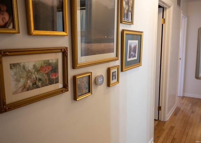 corridor with light wood-type flooring