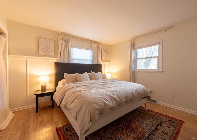 bedroom with hardwood / wood-style floors