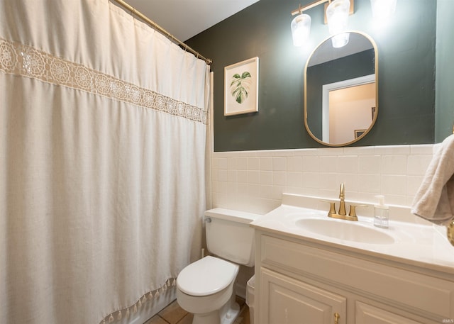 bathroom featuring tile walls, tile patterned flooring, vanity, toilet, and a shower with shower curtain