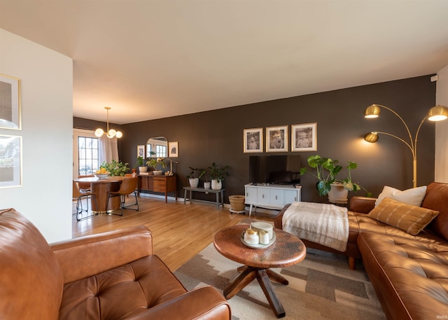 living room featuring hardwood / wood-style flooring and a chandelier