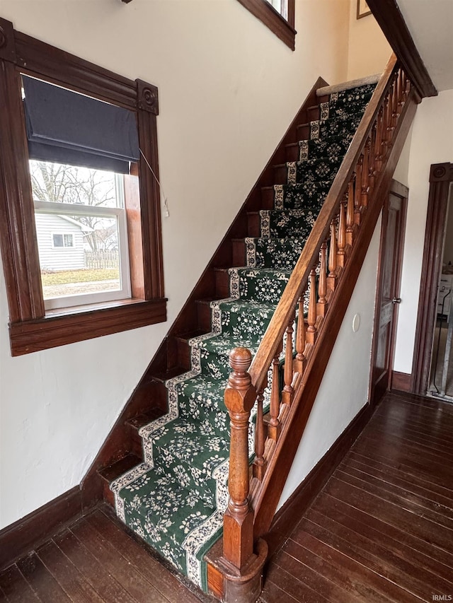 staircase featuring hardwood / wood-style flooring