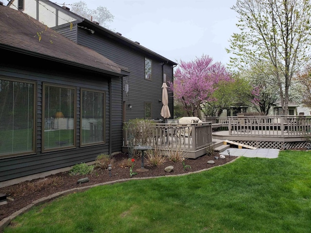 view of yard with a wooden deck