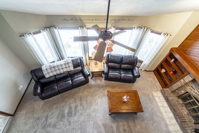 living room with ceiling fan, lofted ceiling, carpet floors, and a textured ceiling