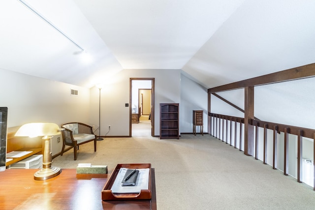 living area with lofted ceiling and carpet