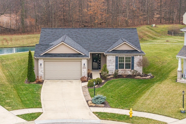 view of front of home featuring a garage and a front lawn