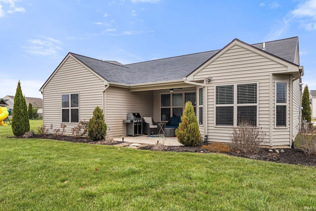 back of house featuring a yard, a playground, a patio, and ceiling fan