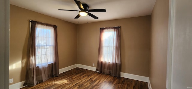 unfurnished room featuring ceiling fan and dark hardwood / wood-style flooring