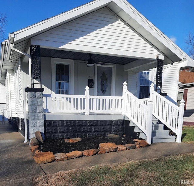 view of front of house featuring ceiling fan and covered porch