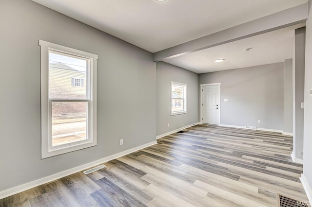 spare room with light hardwood / wood-style flooring