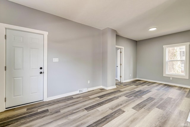 unfurnished room featuring light hardwood / wood-style flooring