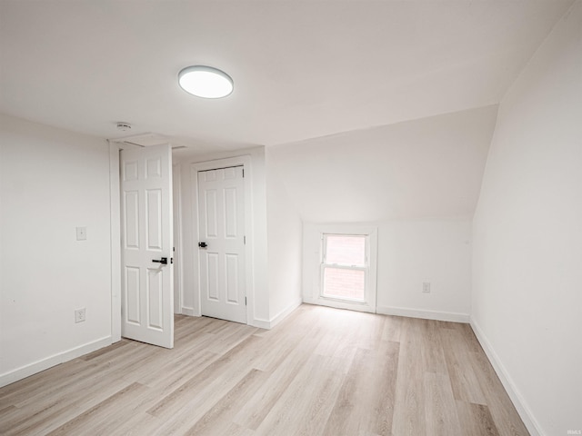 unfurnished room with baseboards and wood finished floors