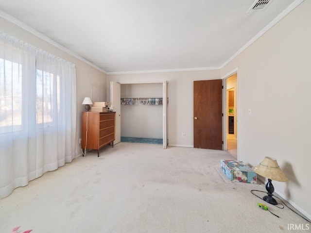 unfurnished bedroom with crown molding and carpet floors