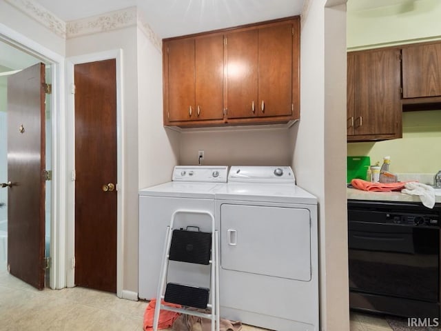 laundry room featuring cabinets, independent washer and dryer, and light tile patterned floors