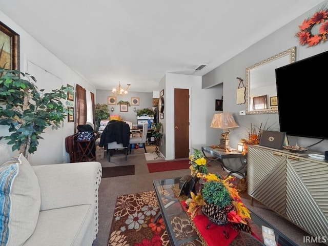 living room with an inviting chandelier and carpet flooring