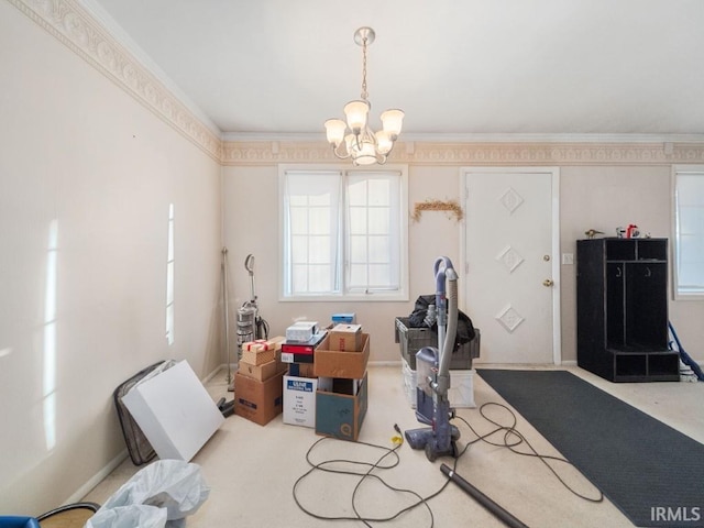 miscellaneous room featuring crown molding and a chandelier