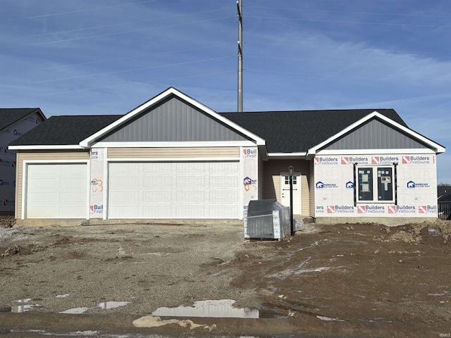 view of front of property with a garage