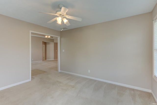 carpeted empty room with ceiling fan