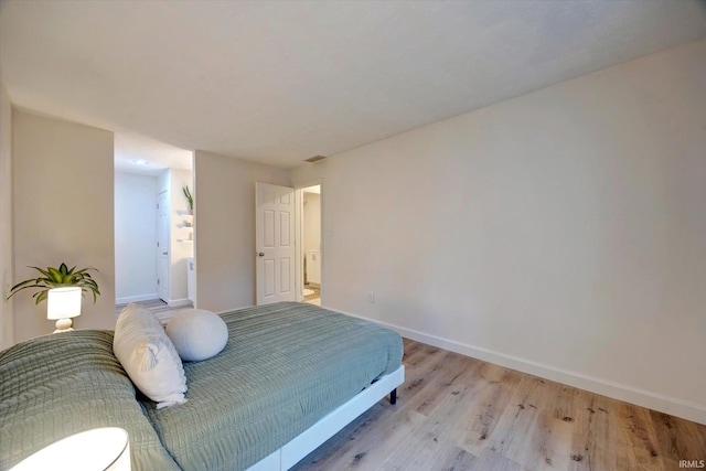 bedroom with light wood-type flooring