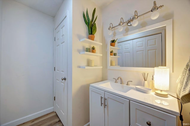 bathroom with vanity and hardwood / wood-style floors